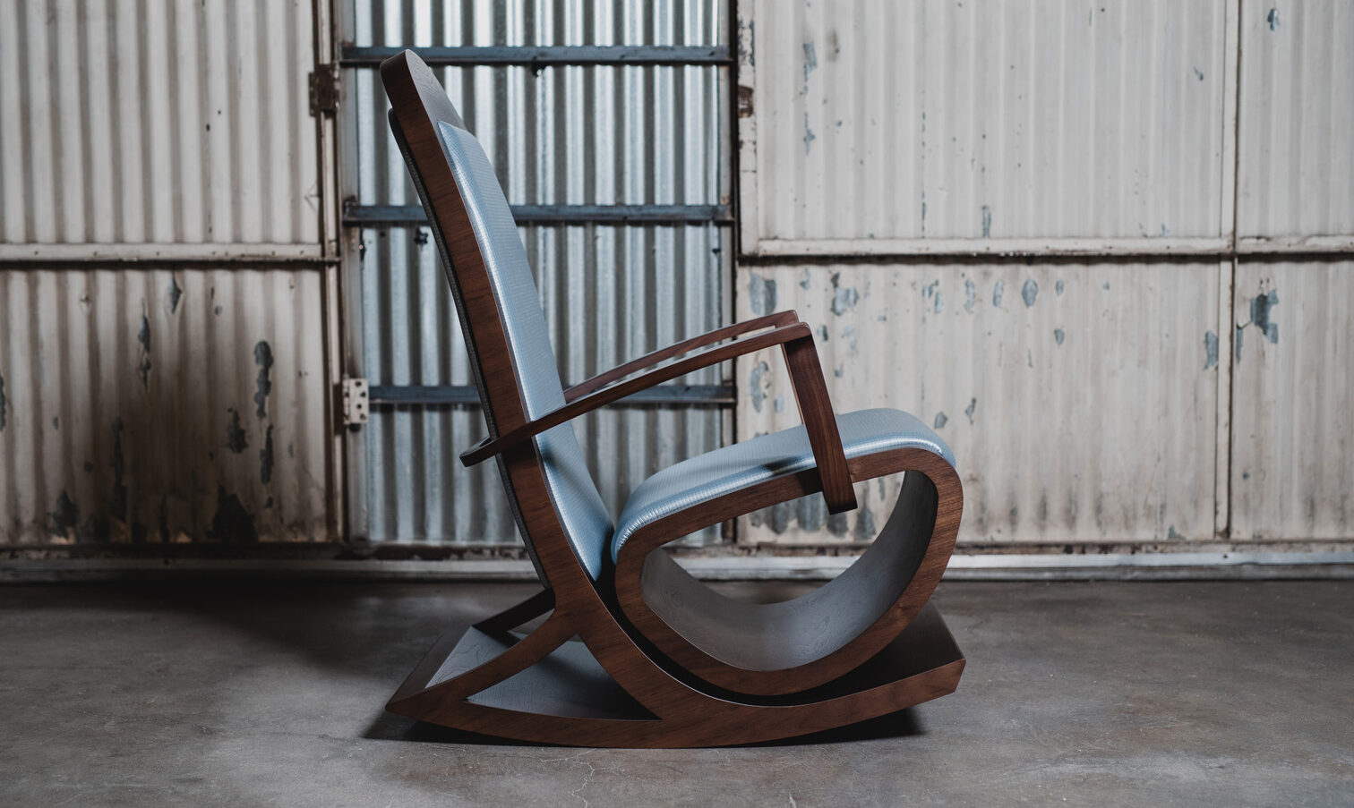 walnut rocking chair with leather upholstery