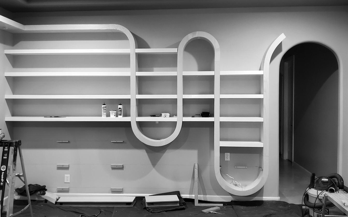 installing hannon-custom-built-in-sculptural-wood-library-